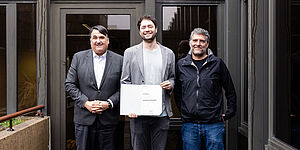 Rector Prof. Dr. Martin Paul, Jonas Haferkamp and Dean Prof. Dr. Gregor Leander during conferring the professorship.
