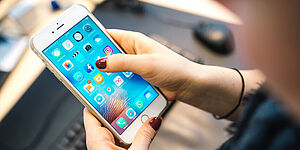 Hand with mobile phone